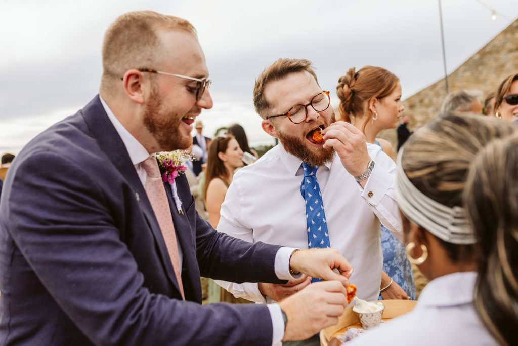 Candid wedding guest photographs at a marquee wedding