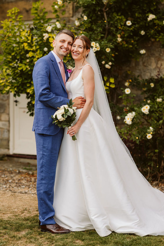 Relaxed wedding portrait of Hester and Chris at their family home