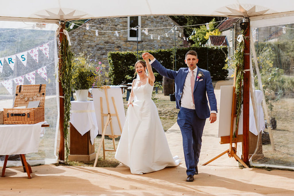 Bride and Groom enter their wedding Breakfast