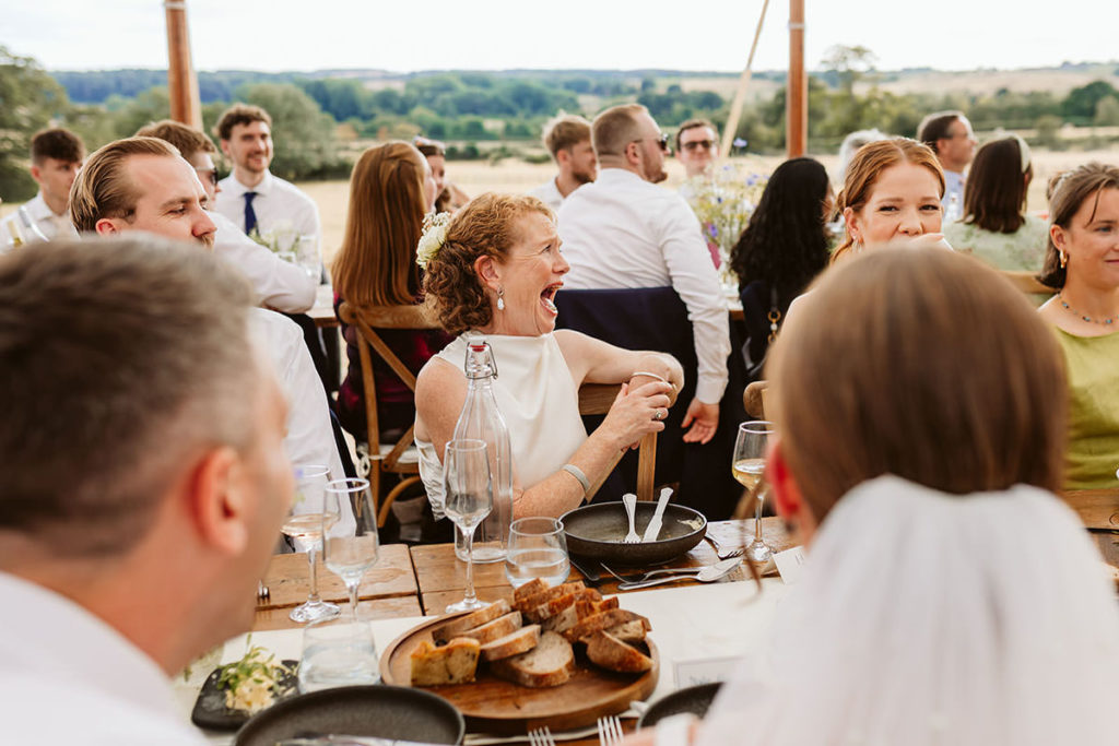 Candid family reactions during wedding speeches