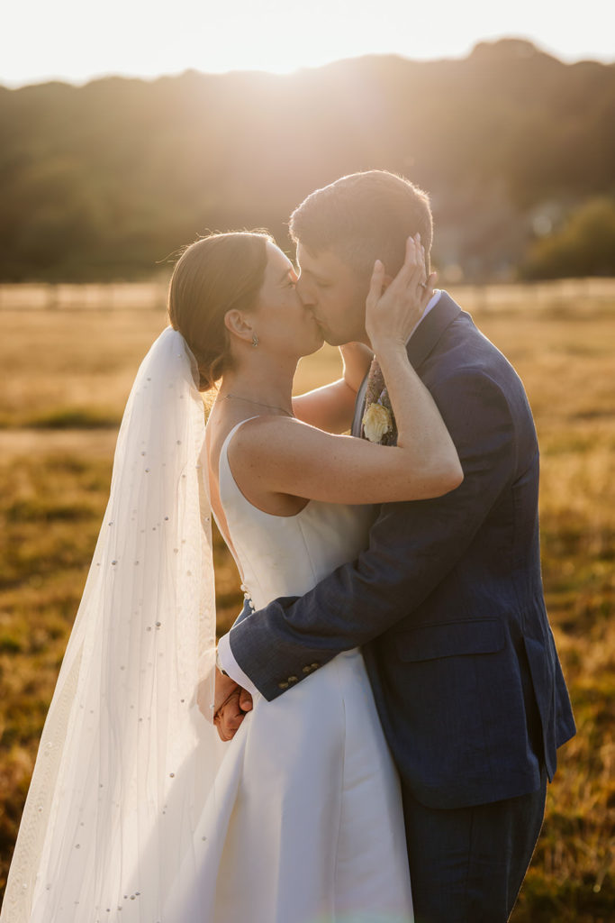 Relaxed couple photographs during a North Yorkshire marquee wedding