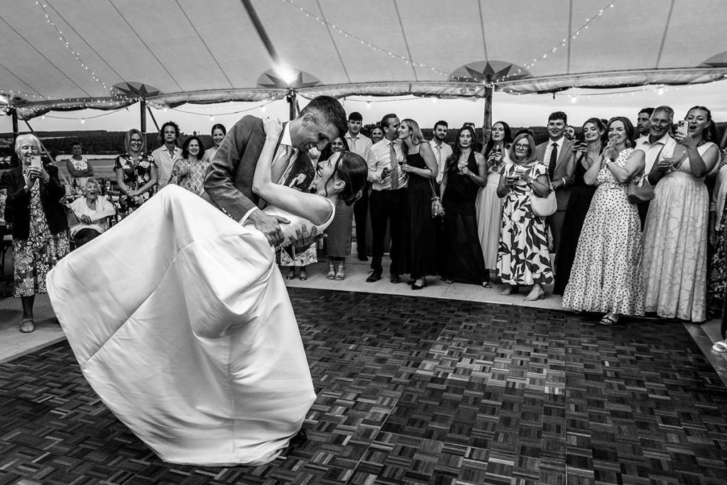 Hester and Chris dancing in front of their friends and family