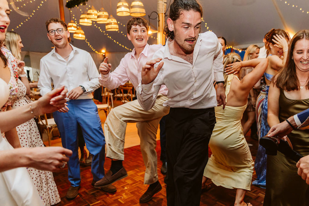 Friends dancing together during Hester and Chris’s wedding party