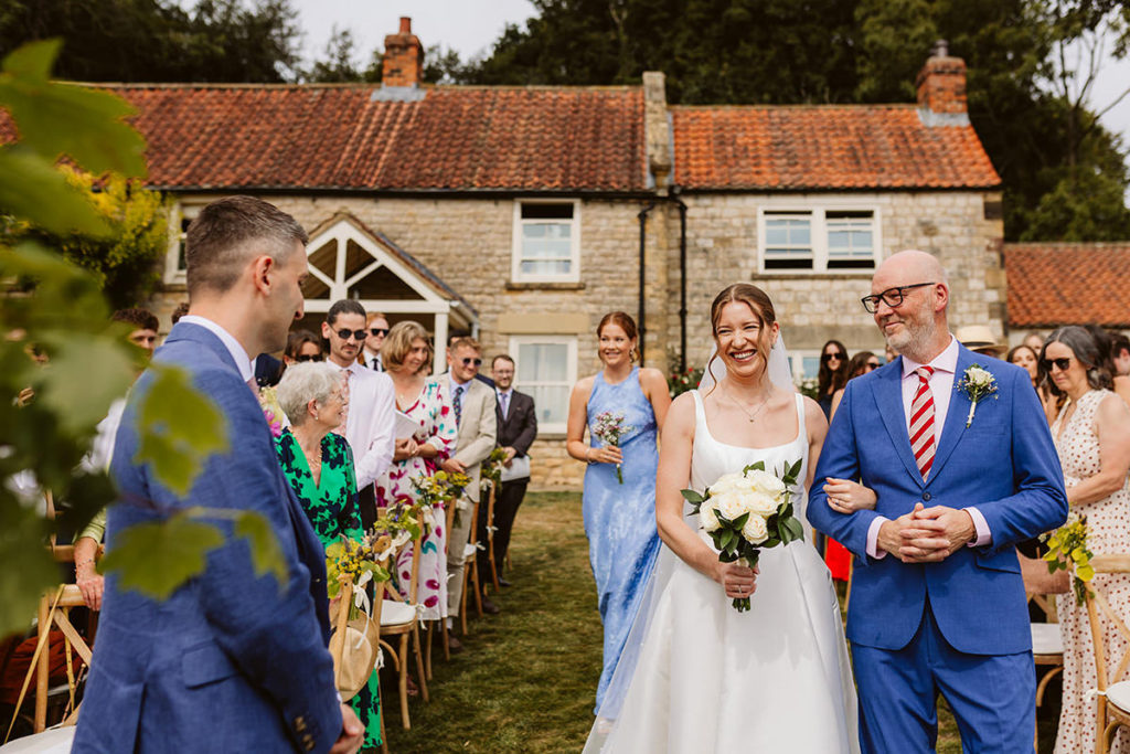 Hester arriving for her wedding ceremony at her family home in Oswaldkirk