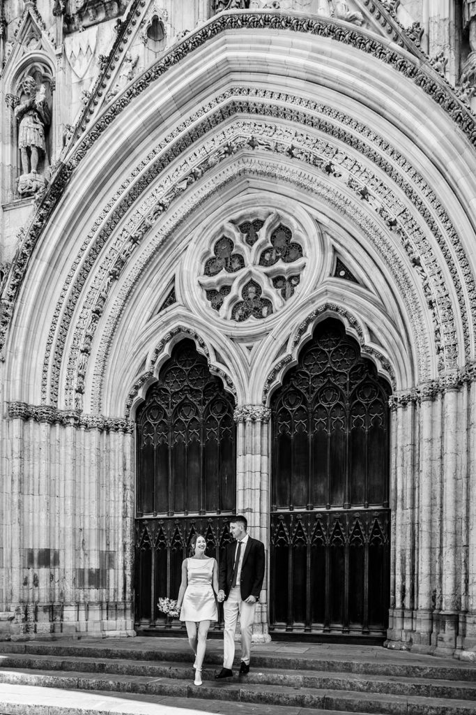 Bride and groom walking through York after their Register Office wedding