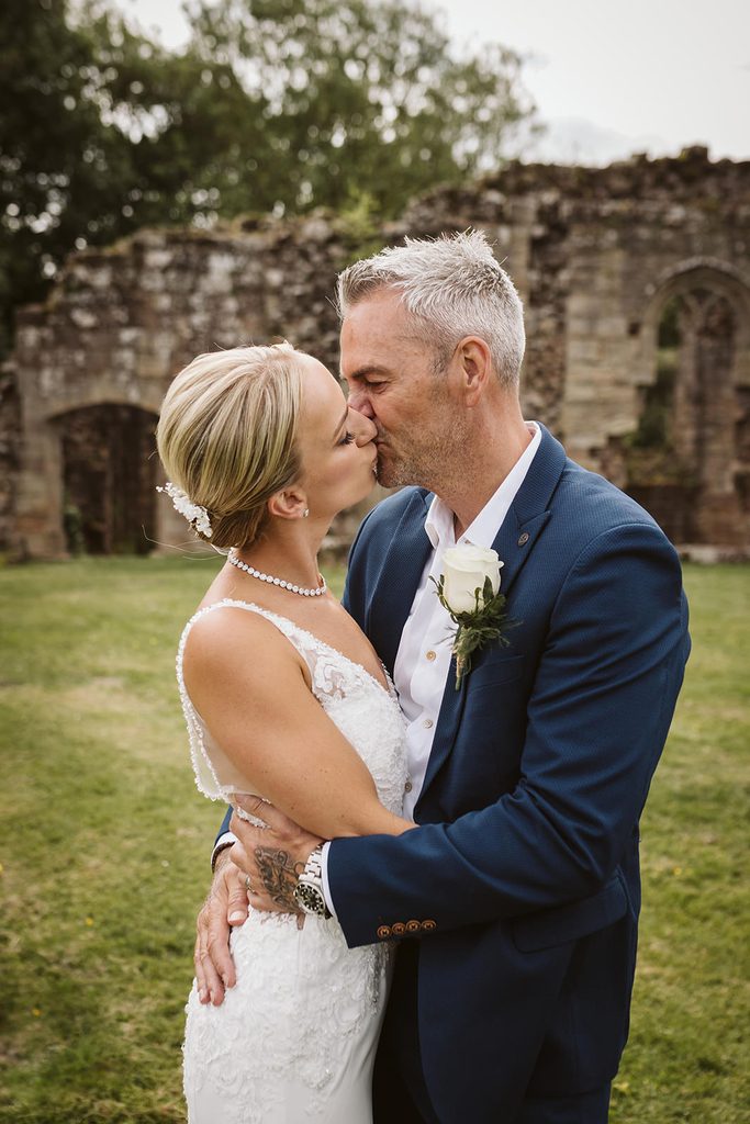 The happy couple share a kiss