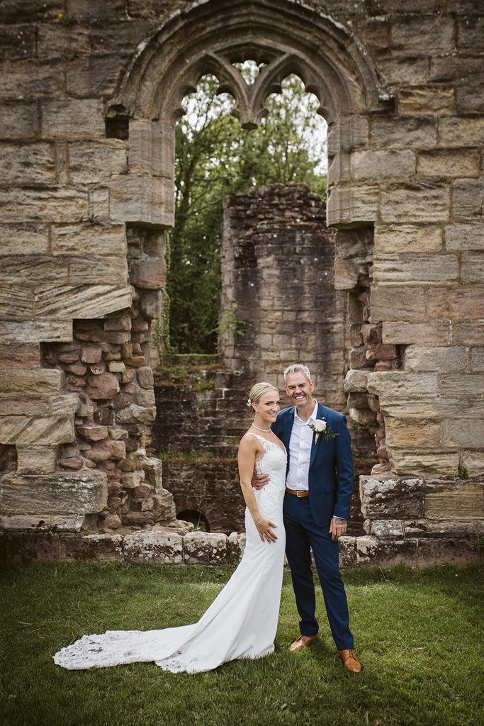 Nat and Martin together beneath a stone archway at Spofforth Castle