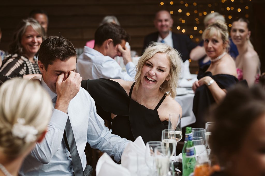 Guests laughing in the Castle Inn during Nat and Martin’s wedding