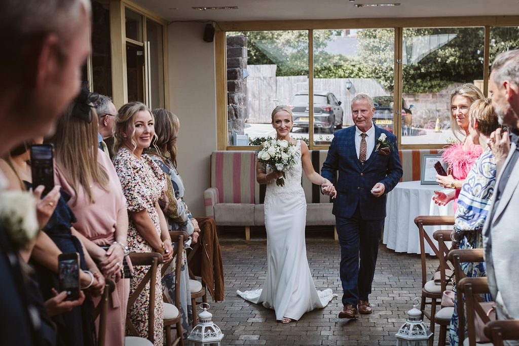 The bride and her father walking down the aisle